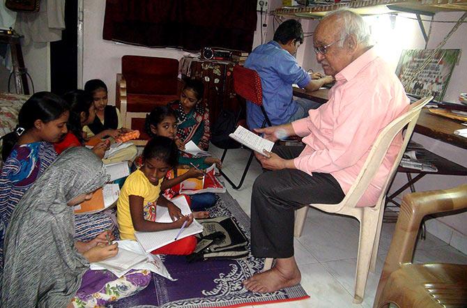 Syed Feroze Ashraf with his students. A former Indian Oil employee, he wrote a column for the Navbharat Times for many years. Photograph: Afsar Dayatar/Rediff.com