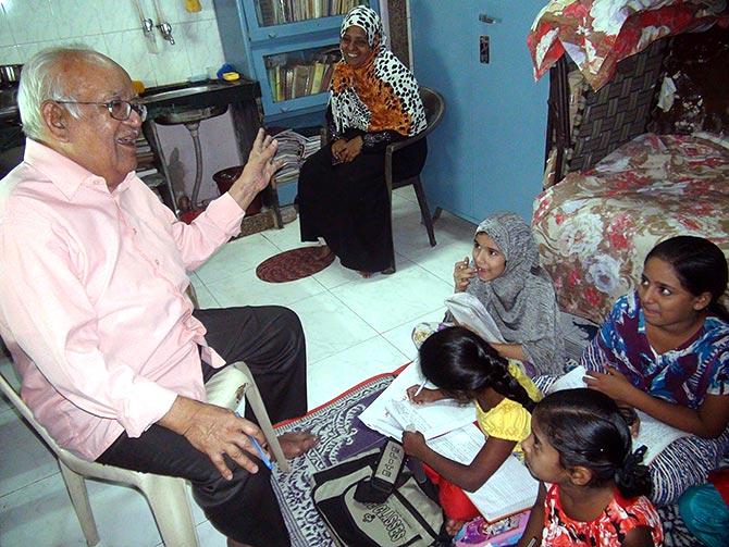 Syed Feroze Ashraf with his students. The do-gooder ran his Uncle's Classes for free and helped many poor Muslims graduate. All photographs: Afsar Dayatar/Rediff.com