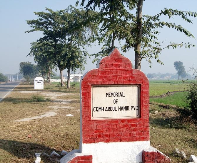 A stone pointing to Company Quarter Master Havildar Abdul Hamid's memorial