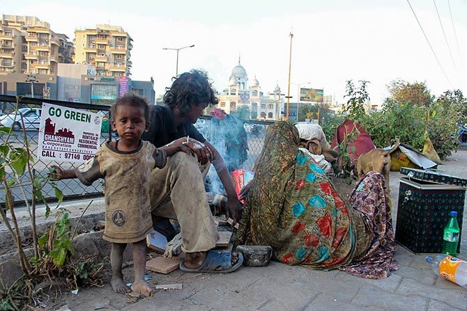 A poor family living on the pavement