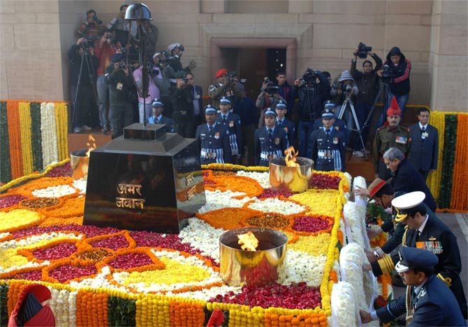 Defence Minister Manohar Parrikar and the three Services Chiefs, the Chief of the Army Staff, General Dalbir Singh, the Chief of the Naval Staff, Admiral R K Dhowan, the Chief of the Air Staff, Air Chief Marshal Arup Raha lay wreaths to honour the Martyrs of the 1971 War, at the Amar Jawan Jyoti, to mark Vijay Diwas, in New Delhi on December 16, 2014. Photograph: Press Information Bureau