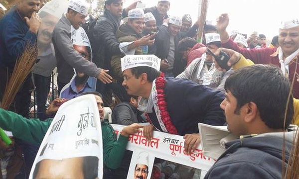 Arvind Kejriwal greets people during a roadshow. Photograph: Aamaadmiparty/Twitter