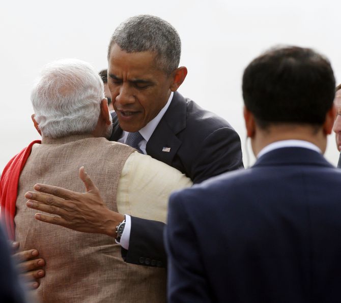 Prime Minister Narendra Modi and US President Barack Obama hug at the Indian Air Force base in Palam, January 25, 2014.