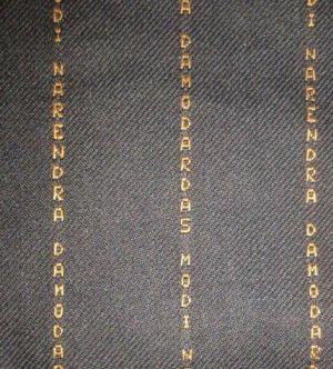 PM's suit with his name woven on it