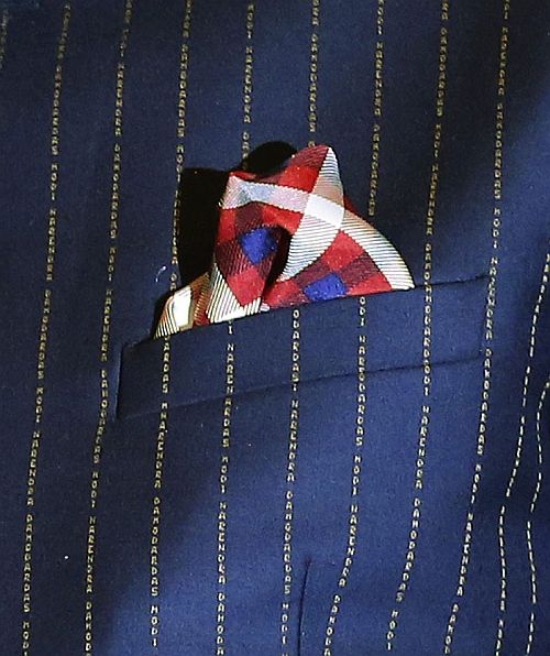 The suit with the prime minister's name woven.
