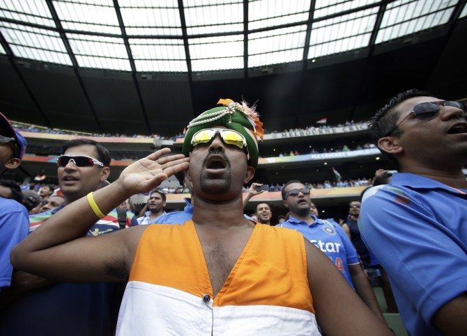 Indian supporters sing the national anthem before the start of the Cricket World Cup match between India and South Africa at the Melbourne Cricket Ground. Photograph: Hamish Blair/Reuters
