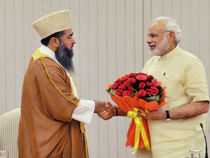 A Muslim community leader greets Prime Minister Narendra Modi, June 3, 2015.