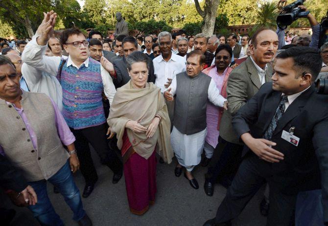 Congress President Sonia Gandhi, Janata Dal-United President Sharad Yadav, CPI Secretary D Raja, Trinamool MP Derek O'Brien and other Opposition leaders march from Parliament to Rashtrapati Bhavan to protest against the land bill, March 17, 2015. Photograph: Subhav Shukla/PTI Photo