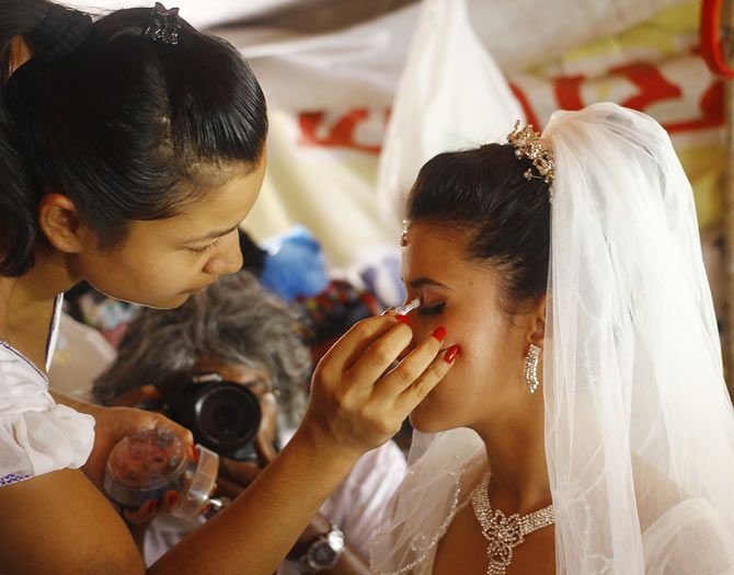 The bride gets a last minute touch-up...