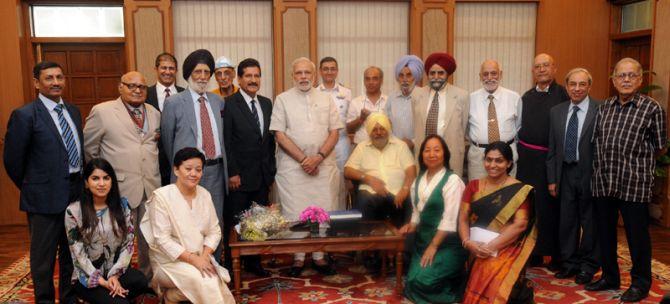 Captain M S Kohli (in black turban) and his team with Prime Minister Narendra Modi 