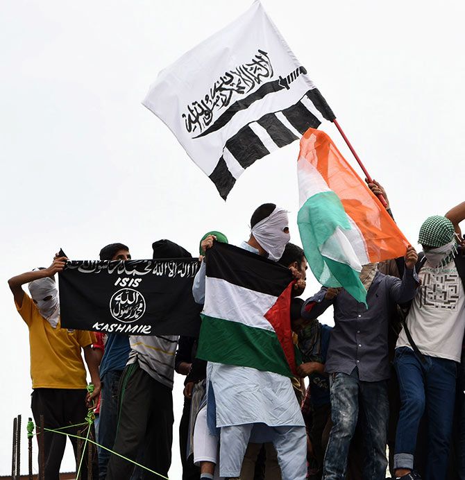 Waving the ISIS flag in Kashmir. Photograph: Umar Ganie/Rediff.com
