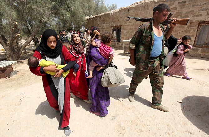 People flee from Islamic State violence in Nibai, Iraq.