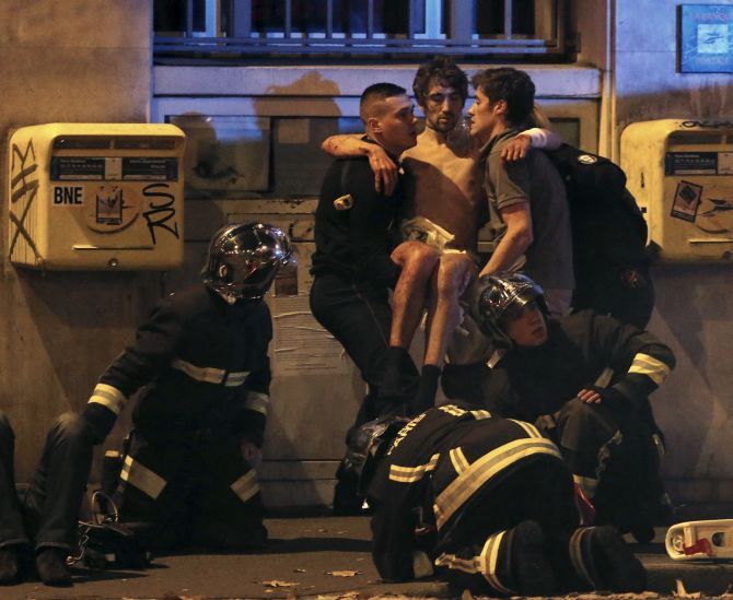 An injured victim being rushed to hospital in Paris, November 13, 2015. Photograph: Christian Hartmann/Reuters