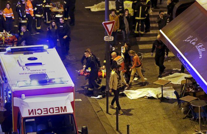 Rescue service personnel outside a restaurant in Paris where several people were murdered by terrorists on November 13. Photograph: Philippe Wojazer/Reuters