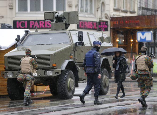 Belgian soldiers patrol central Brussels after Belgium was put on lockdown for fears of a terror attack. Photograph: Youssef Boudlal/Reuters