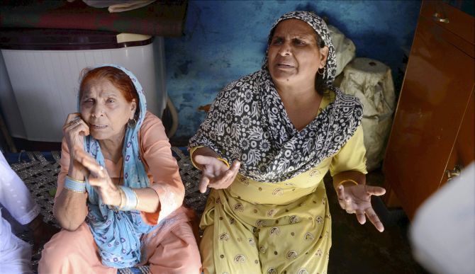 Relatives mourn Mohammad Akhlaq, who was lynched by a mob, at his home in Bisara village, Dadri, Uttar Pradesh. Photograph: PTI 
