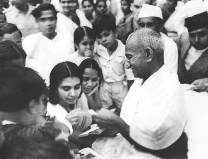 Mahatma Gandhi signing autographs at Juhu