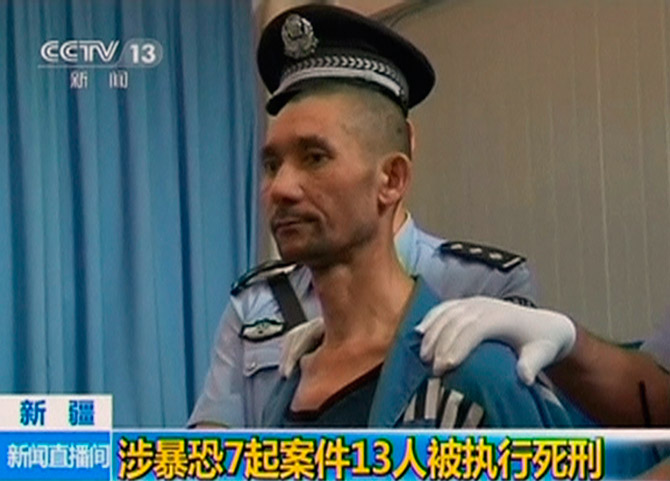 A man sentenced to be executed in the Xinjiang Uighur Autonomous Region, June 16, 2014. He was among 13 men China executed for 'terrorist attacks' in Xinjiang.  The 13 men were allegedly involved in attacks in different parts of China's Muslim-majority province Xinjiang, including one that killed 24 policemen, Xinhua said. Photograph: Reuters