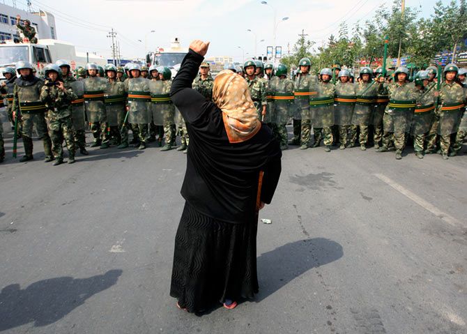 A woman confronts Chinese paramilitary police on a street in Urumqi in China's Xinjiang Autonomous Region July 7, 2009. Hundreds of Uighur protesters clashed with riot police in the capital of China's Muslim region of Xinjiang, two days after ethnic unrest left 156 dead and more than 800 injured. Photograph: David Gray/Reuters