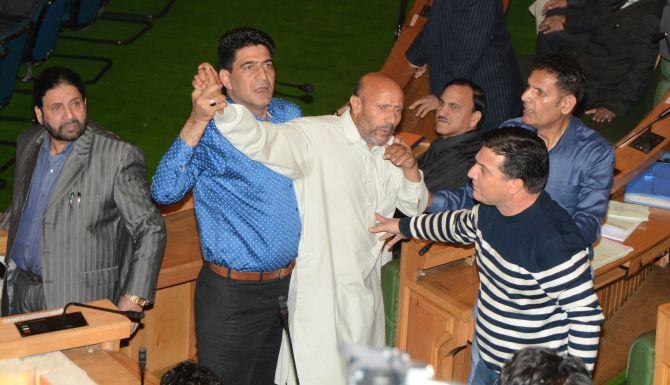 Independent J&K MLA Engineer Rashid being taken away after the attack