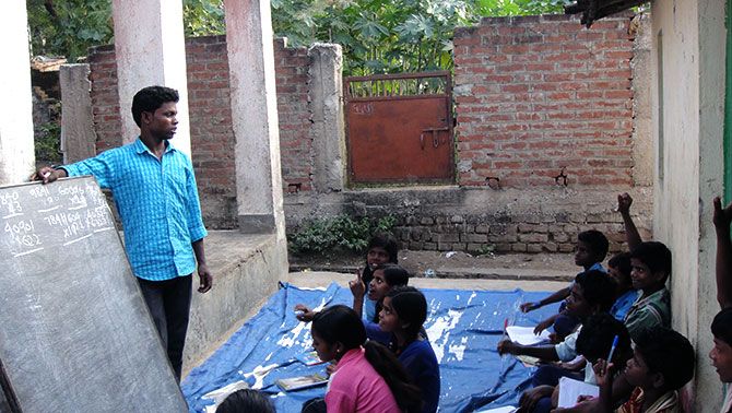 Deepak, an economics student, teaches children