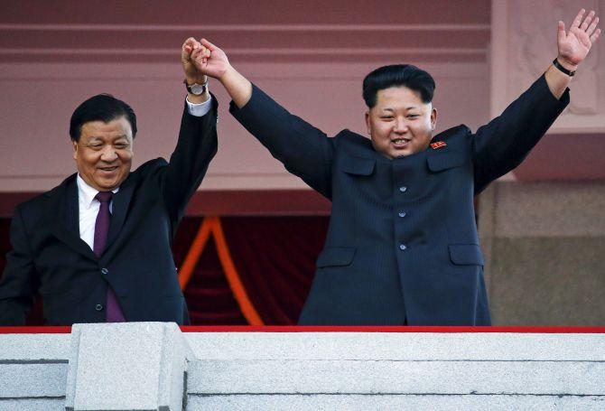 Kim Jong-un with Liu Yunshan, a member of China's Politburo Standing Committee, the Chinese Communist Party's highest decision-making body, at the military parade in October 2015. Photograph: Damir Sagolj/Reuters