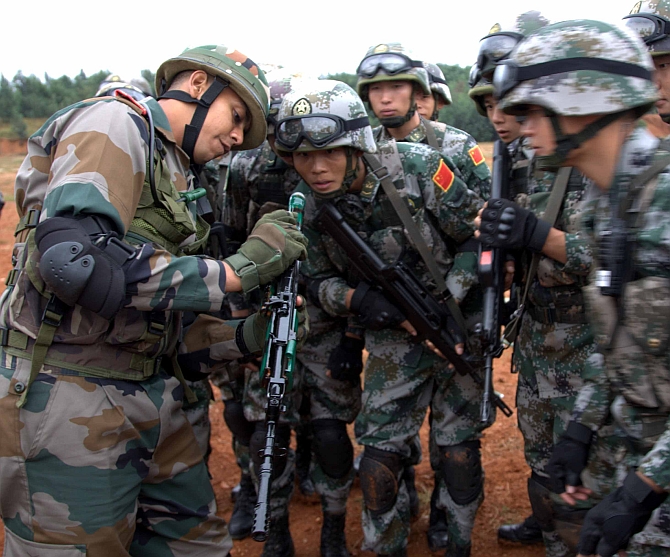 India and China in 'hand-in-hand' combat! - Rediff.com India News
