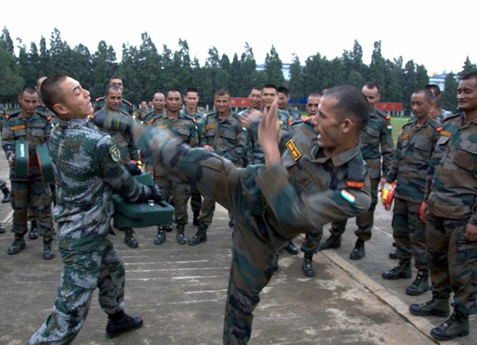An Indian soldier tries out his martial arts on a Chinese trooper during the India-China military exercises in Kunming, south-west China, October 2015. Photograph: Kind courtesy The Indian Army
