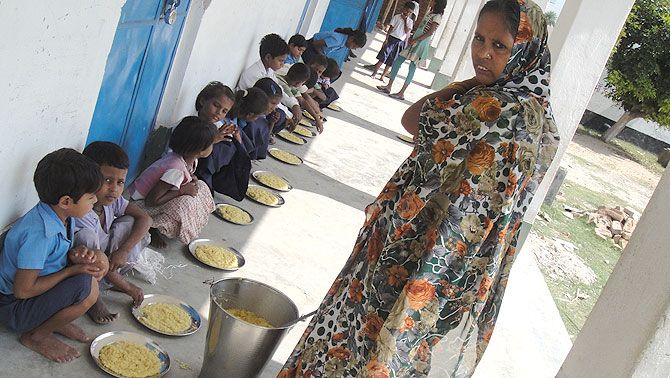 Children being served midday meal