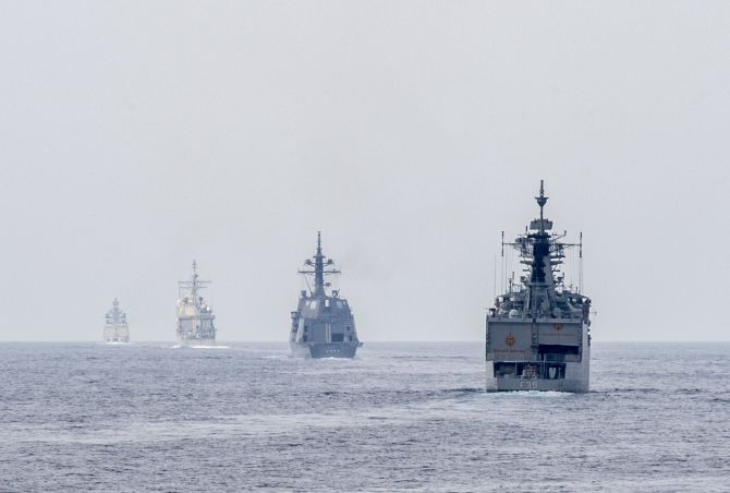 Ships from the Indian navy, Japan Maritime Self Defense Force and US Navy get into formation for a gunnery live-fire exercise as part of Malabar 2015.