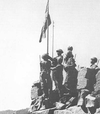 Indian troops raise the tricolour at Haji Pir Pass after vanquishing the Pakistan army in the 1965 war