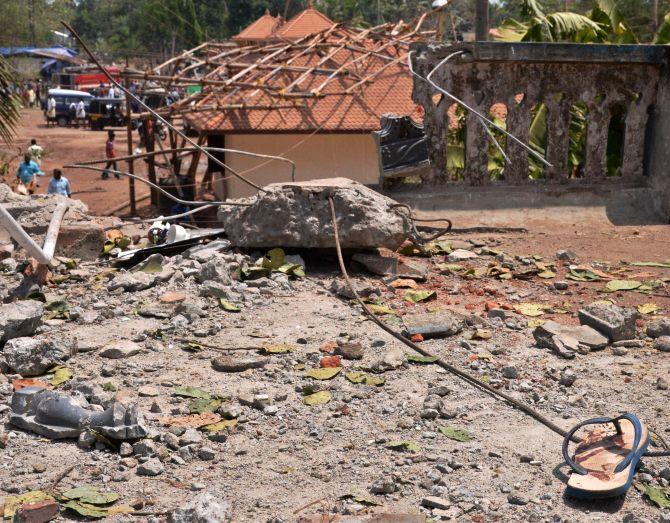 A view of a collapsed building after a massive fire broke out during a fireworks display in Paravur north of Thiruvananthapuram in Kerala. Photograph: PTI