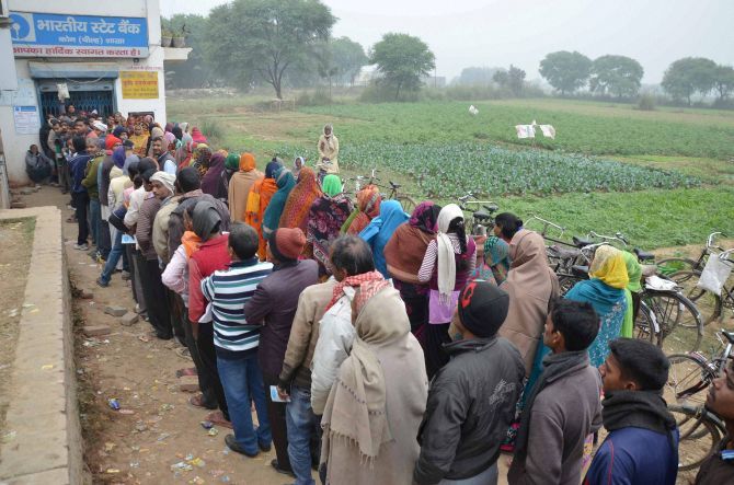 People queue up for money outside a bank