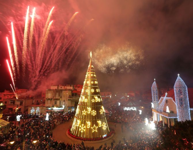 Fireworks are set off as a Christmas tree is illuminated in Dhour Shweir, Mount Lebanon. Photograph: Aziz Taher/Reuters