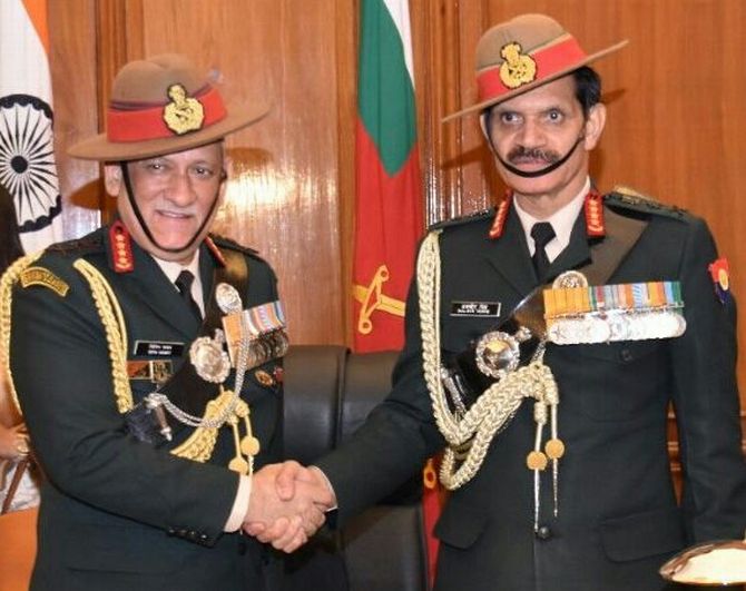 General Bipin Rawat, left, the new army chief, with General Dalbir Singh Suhag.