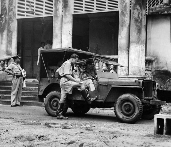 Circa 1940: Soldiers manning a wireless van during Mahatma Gandhi's 73 hour fast, receive news about the riots from police headquarters at Lalbazar.