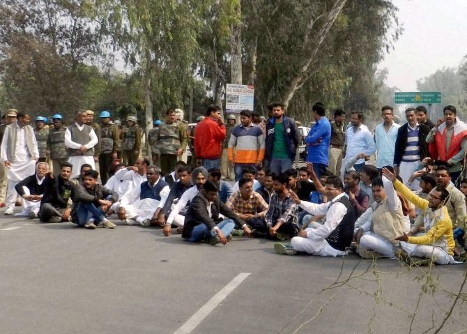 Jats protest on a Haryana street demanding reservations. Photograph: PTI