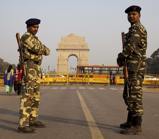 Troopers guard the India Gate in New Delhi ahead of Republic Day.