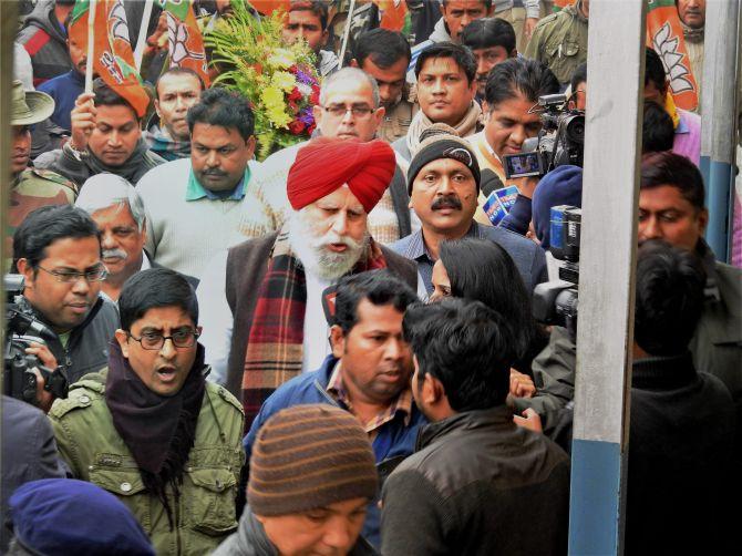 BJP MPs S S Ahluwalia, right, Bishnu Dayal Ram and Bhupender Yadav were denied permission to visit violence-hit Kaliachak in West Bengal’s Malda district by the state government. Photograph: PTI Photo