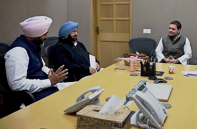 Punjab Finance Minister Manpreet Singh Badal, left, and Punjab Chief Minister Captain Amarinder Singh (retd) with Congress President Rahul Gandhi. Photograph: PTI Photo