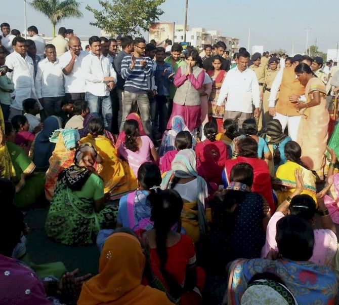 Trupti Desai (in pink) leads the protest for entry of women into the Shani Shignapur temple complex in Ahmednagar. Photograph: PTI