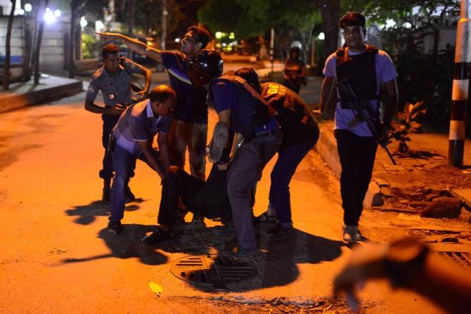 An injured man receives help after the attack. Photograph: Mahmud Hossain Opu/Getty Images