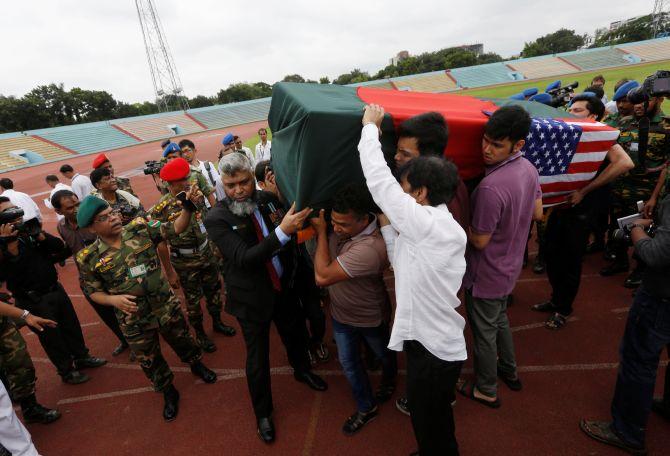 Relatives carry the coffin of a victim killed in the attack on the Holey Artisan Bakery and the O'Kitchen restaurant, after a memorial ceremony, in Dhaka. Photograph: Adnan Abidi/Reuters