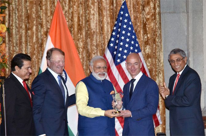 Then USIBC President Dr Mukesh Aghi, left, CISCO CEO John Chambers, second from left, watch Prime Minister Narendra D Modi present the USIBC Global Leadership Award to Amazon founder Jeff Bezos, Washington, DC, June 7, 2016. Photograph: Press Information Bureau