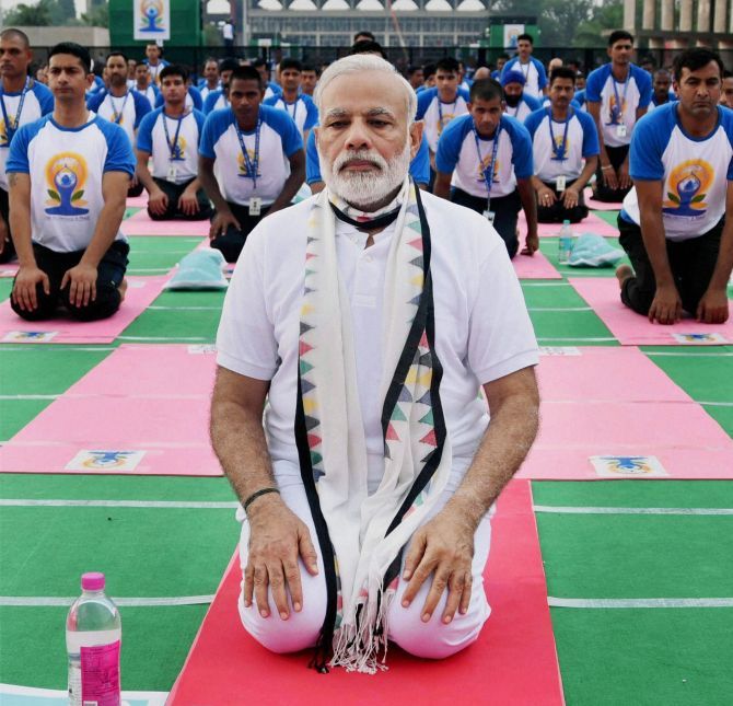 Prime Minister Narendra Modi takes part in the mass yoga event on the 2nd International Day of Yoga at Capitol Complex in Chandigarh. Photograph: PTI