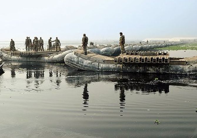 The Indian Army building a pontoon bridge over the Yamuna for the AOL World Culture Festival