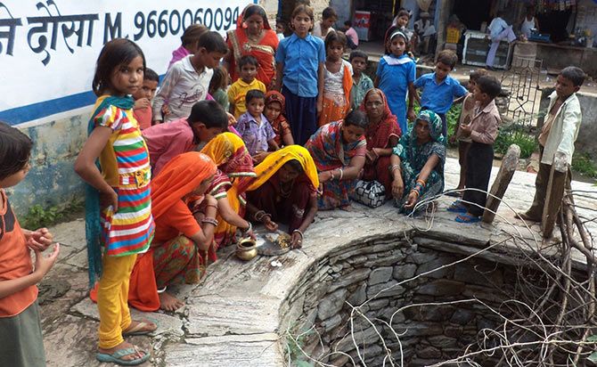 A kuwa puja (worshipping the well) ceremony takes place to celebrate the birth of a girl child in Dausa, Rajasthan.