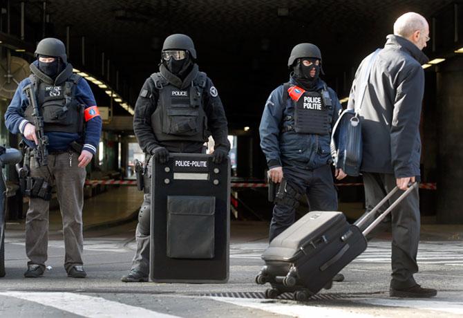 Policemen stand guard at the Midi train station following the bomb attacks in Brussels, March 22, 2016. Photograph: Christian Hartmann/Reuters