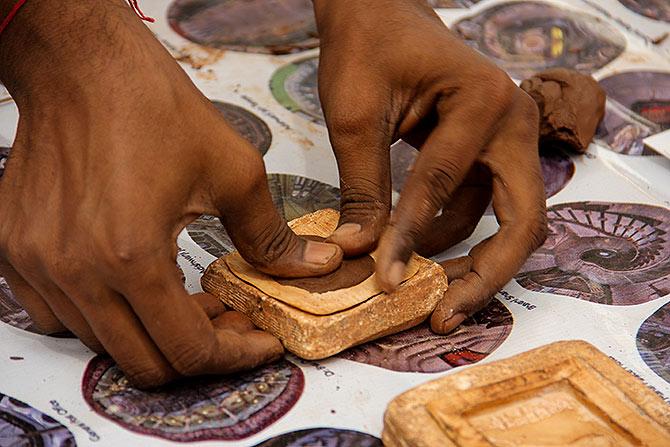 The clay is evenly pressed into the mould.