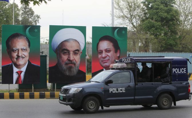 Portraits of Pakistan's President Mamnoon Hussain, Iranian President Hassan Rouhani and Pakistan's Prime Minister Nawaz Sharif displayed during Rouhani's visit to Islamabad, March 2016. Photograph: Faisal Mahmood/Reuters